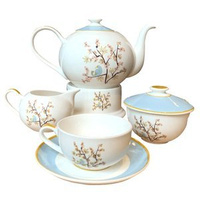 `Michiko` A set of a teapot with a warmer, four cups, a sugar bowl and a milk jug